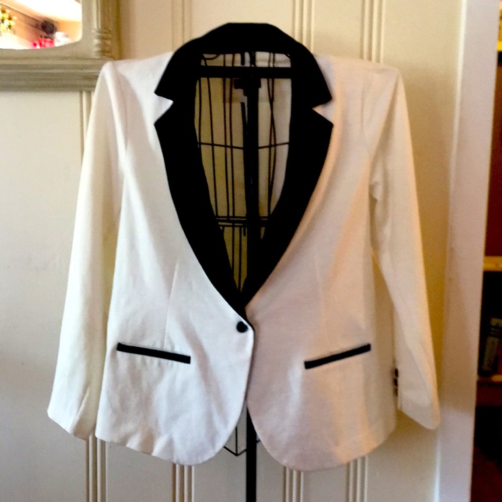 Blazer off white with black trim.